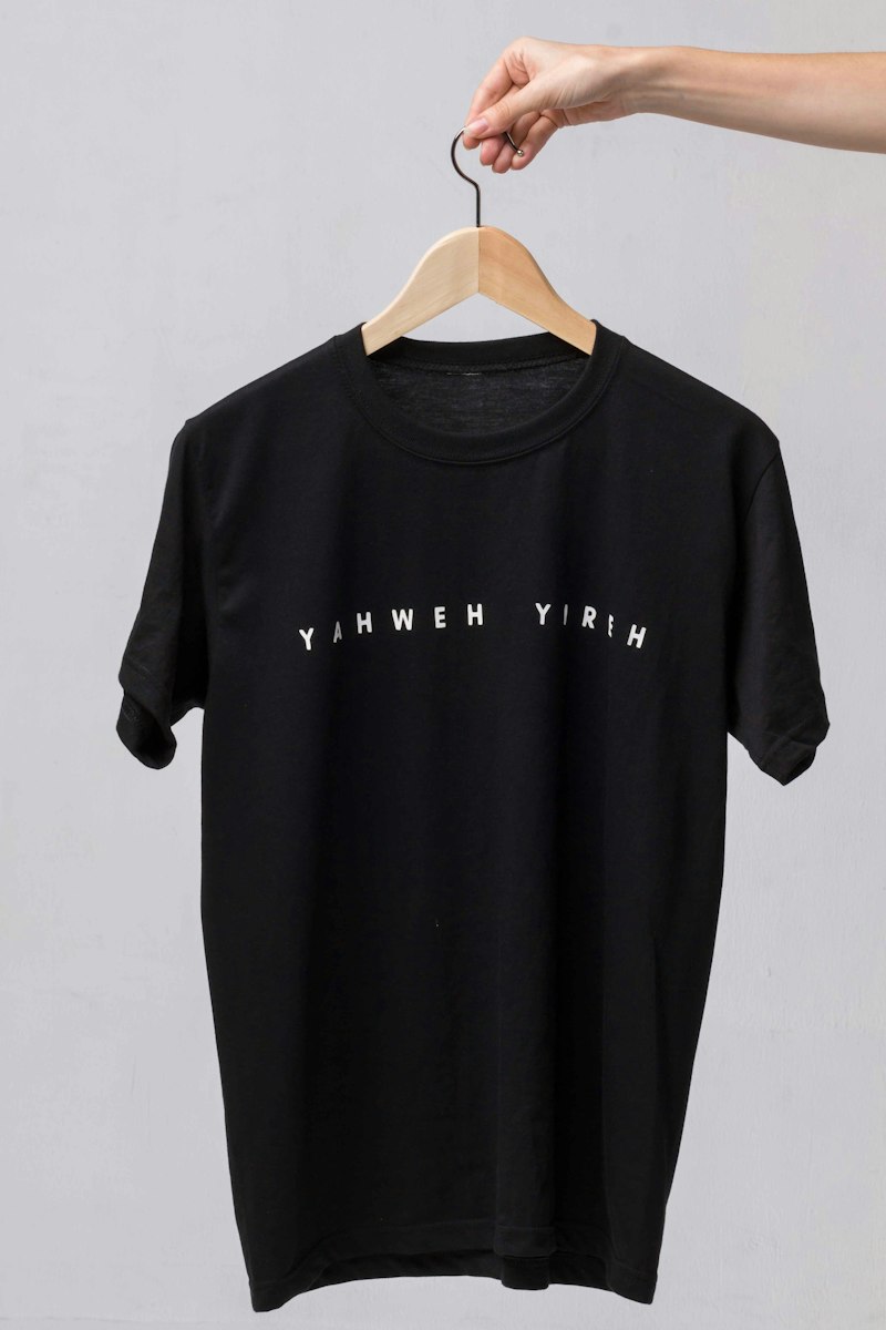 Man wearing funny graphic tee smiling